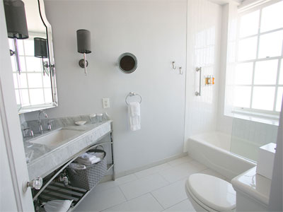 White Bathroom Reflects More Light and Can Make Small Bathroom Look Larger